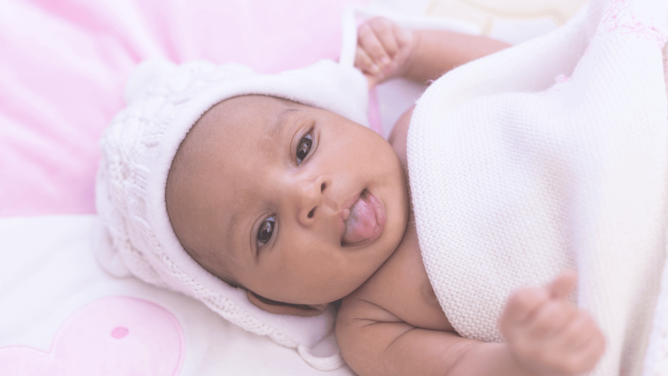 Infant with tongue sticking out