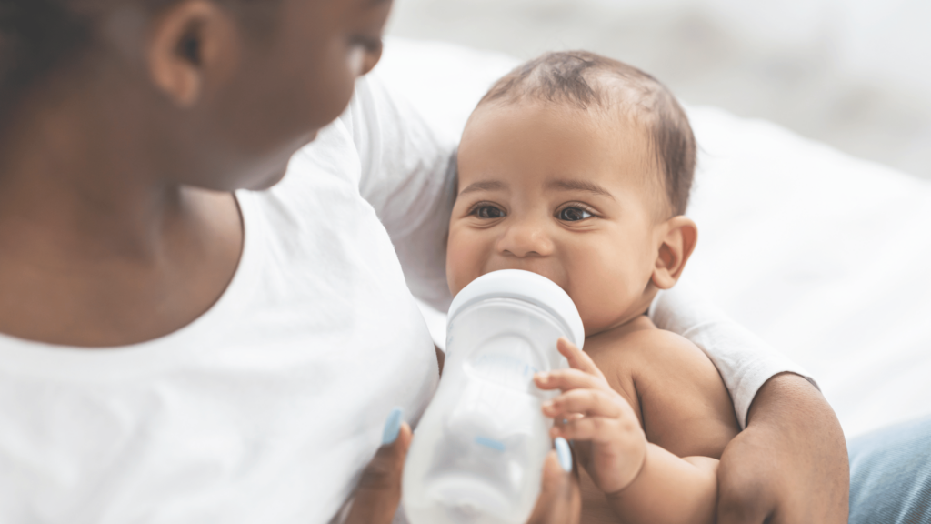 Baby drinking milk from bottle